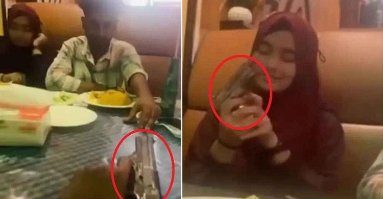 রেস্টুরেন্টে প্রেমিকার হাতে পিস্তল তুলে দিল প্রেমিক, ভিডিও ভাইরাল